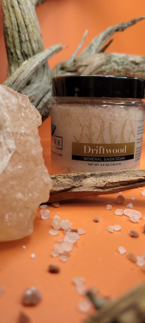 Mini Evolve Botanica Mineral Soak Driftwood bath salt in a jar, showing the textured mineral crystals and natural driftwood scent.