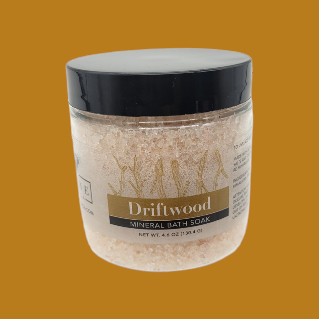 Mini Evolve Botanica Mineral Soak Driftwood bath salt in a clear jar with natural driftwood scent, perfect for relaxing baths.