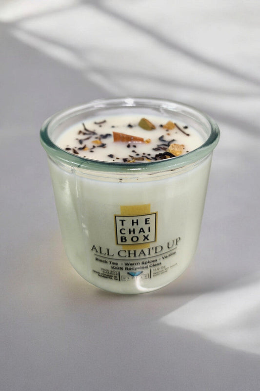 Evolve Botanica Rocks Candle Chai with a wood wick and gemstone, made from soy wax, showcasing a cozy and decorative candle.