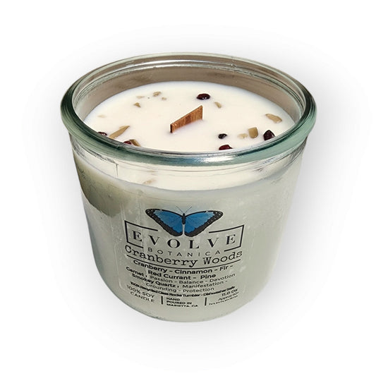 Evolve Botanica Cranberry Woods Rocks Candle with wood wick, garnet, and smoky quartz gemstones in a soy candle.