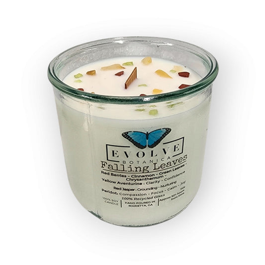 Evolve Botanica Rocks Candle Falling Leaves with wood wick, Peridot, Red Jasper, and Yellow Aventurine gemstone soy candle.