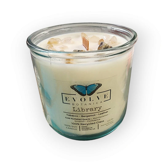 Evolve Botanica Rocks Candle Library with wood wick, gold rutilated quartz gemstone, soy wax, and elegant glass jar.