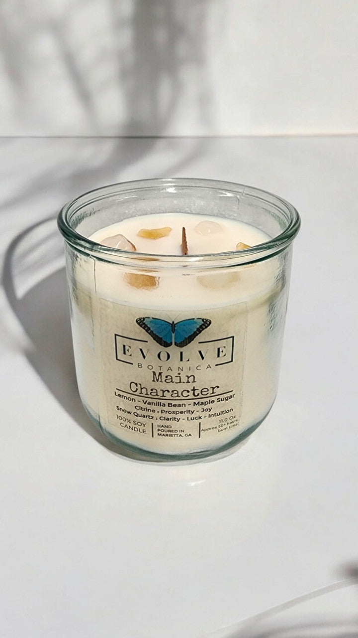 Evolve Botanica Rocks Candle with wood wick, citrine, snow quartz gemstones, soy wax, and a natural, textured design.