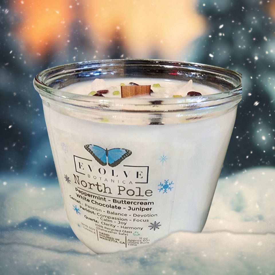 Evolve Botanica Rocks Candle North Pole with wood wick, garnet, peridot, and quartz for passion, balance, compassion, joy, harmony, and clarity.