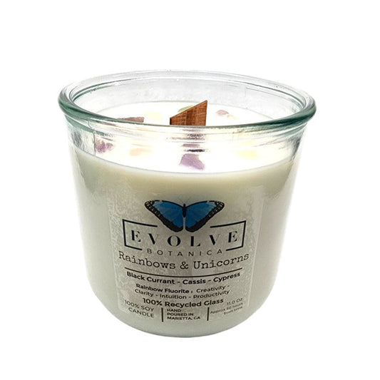 Evolve Botanica Rocks Candle featuring rainbows, unicorns, rainbow fluorite gemstone, soy wax, and a wood wick for a cozy glow.