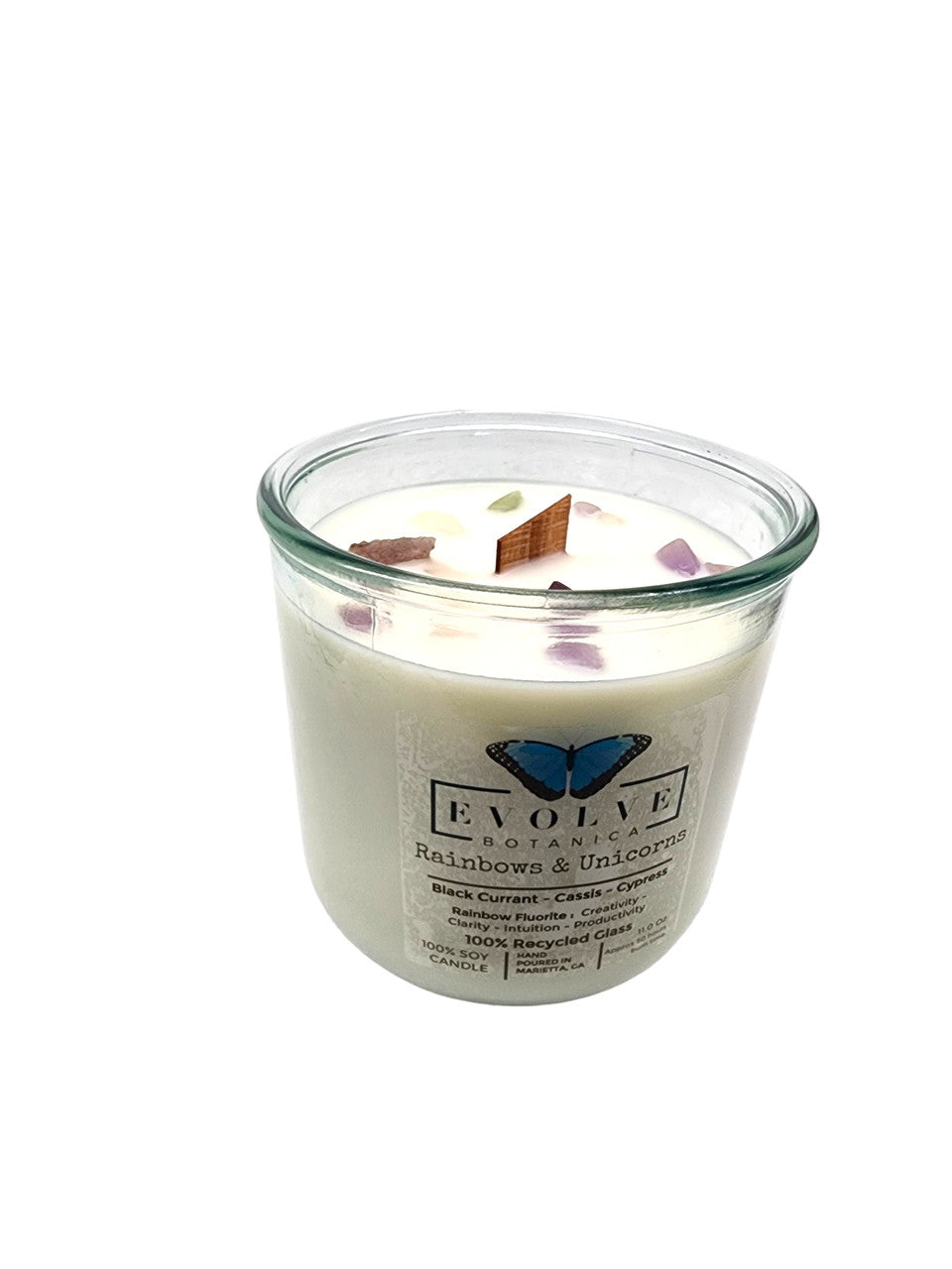 Evolve Botanica Rainbows & Unicorns soy candle with rainbow fluorite gemstone and wood wick, colorful unicorn and rainbow design.