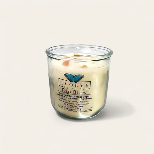 Evolve Botanica Rocks Candle Rio Glow soy candle with Sunstone and Citrine gemstones, featuring a wood wick and natural aesthetic.