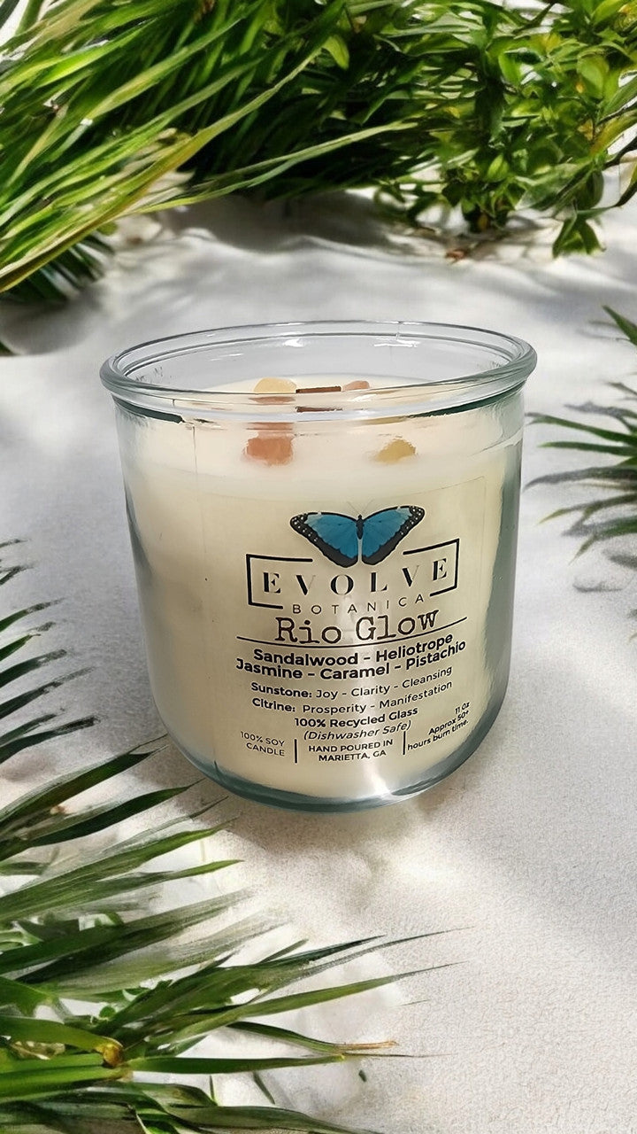 Evolve Botanica Rocks Candle Rio Glow with wood wick, sunstone, and citrine gemstones in a soy candle.
