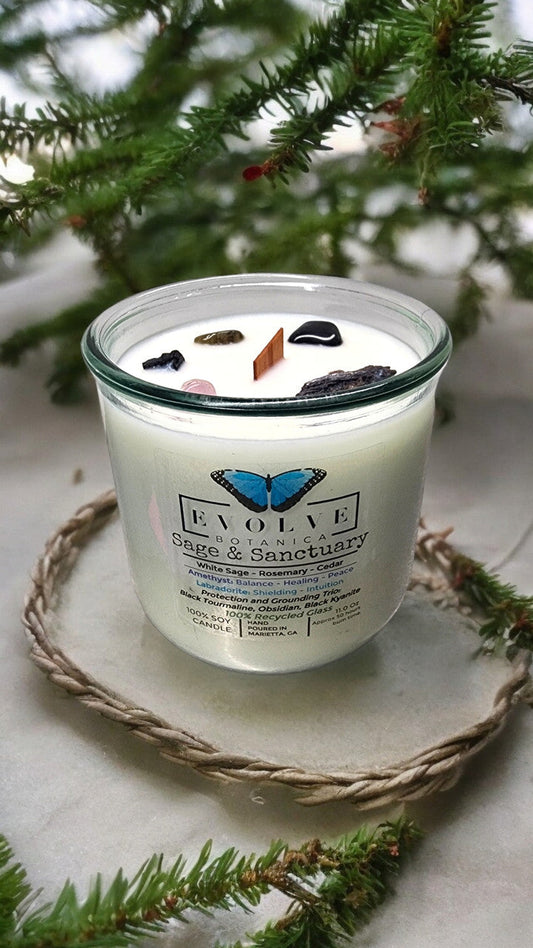 Evolve Botanica Rocks Candle Sage & Sanctuary with Black Kyanite, Tourmaline, Obsidian, Amethyst, Labradorite crystals.