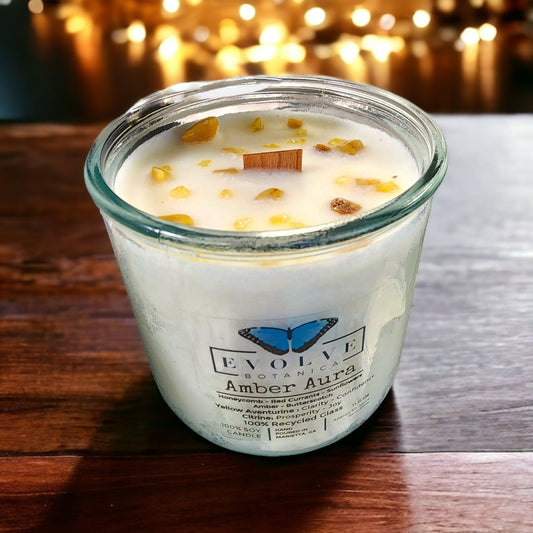 Evolve Botanica Rocks Candle Warm Wishes with wood wick, Citrine and Aventurine gemstones, soy wax, designed for relaxation and ambiance.