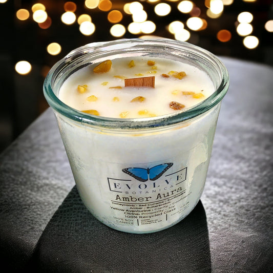Evolve Botanica Rocks Candle Warm Wishes with wood wick, Citrine and Aventurine gemstone, soy wax, and a cozy, natural vibe.