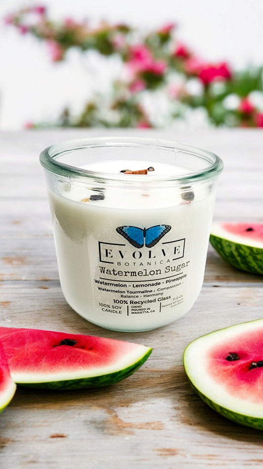 Evolve Botanica Watermelon Sugar Rocks Candle with wood wick, gemstone accents, soy wax, and vibrant watermelon scent.