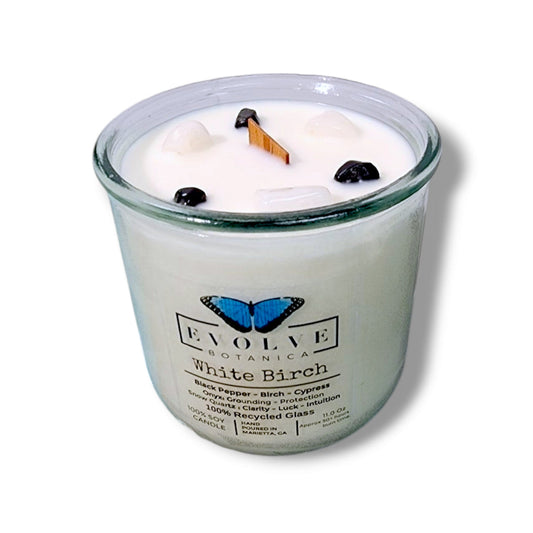 White Birch Rocks Candle by Evolve Botanica featuring wood wick, snow quartz, and onyx gemstones in a soy candle.
