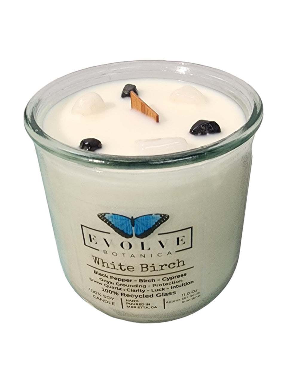 White birch soy candle with wood wick, embedded snow quartz and onyx gemstones, by Evolve Botanica.