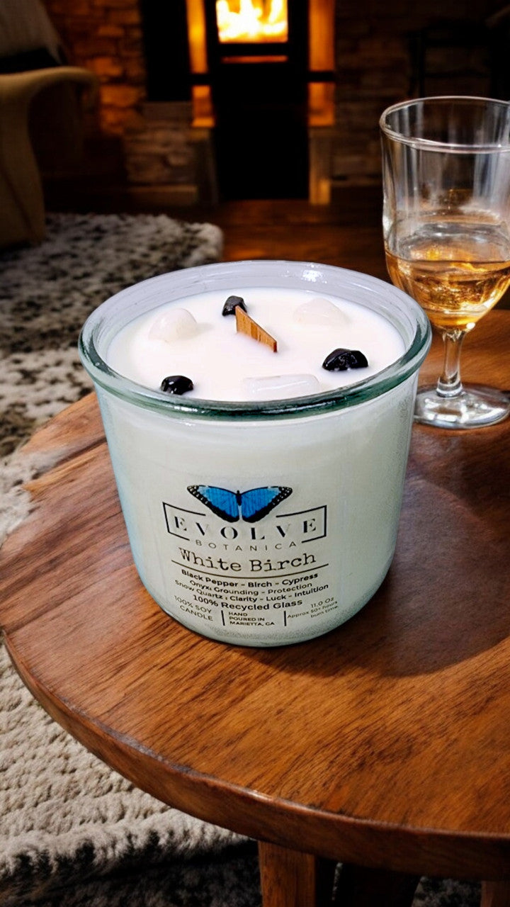 White Birch Rocks Candle by Evolve Botanica featuring wood wick, snow quartz, onyx gemstones, and soy wax for a calming ambiance.