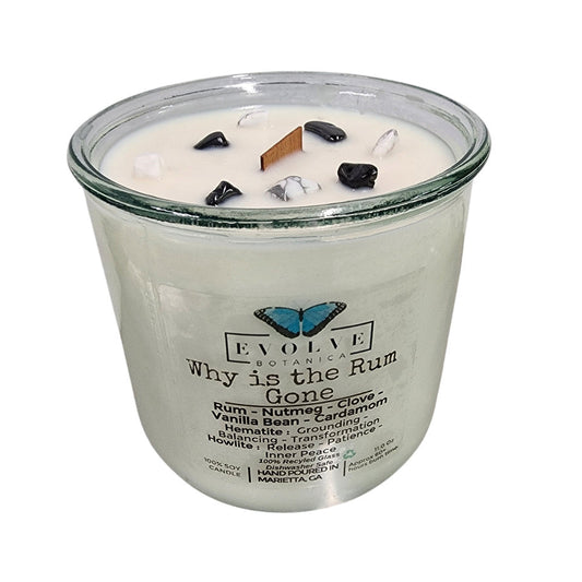 Evolve Botanica Rocks Candle with wood wick, hematite, and howlite stones for grounding, balance, and inner peace.