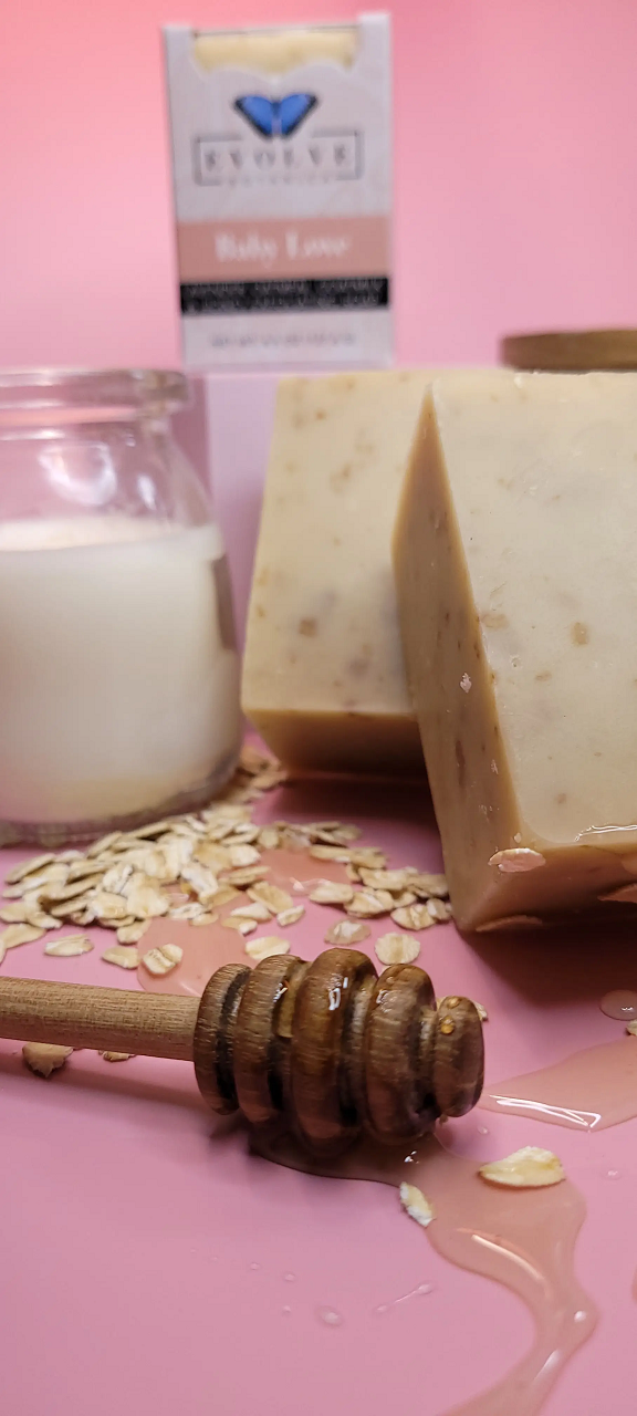 Evolve Botanica Baby Love goat milk specialty soap wrapped in unprinted glassine bag for gentle skin care.
