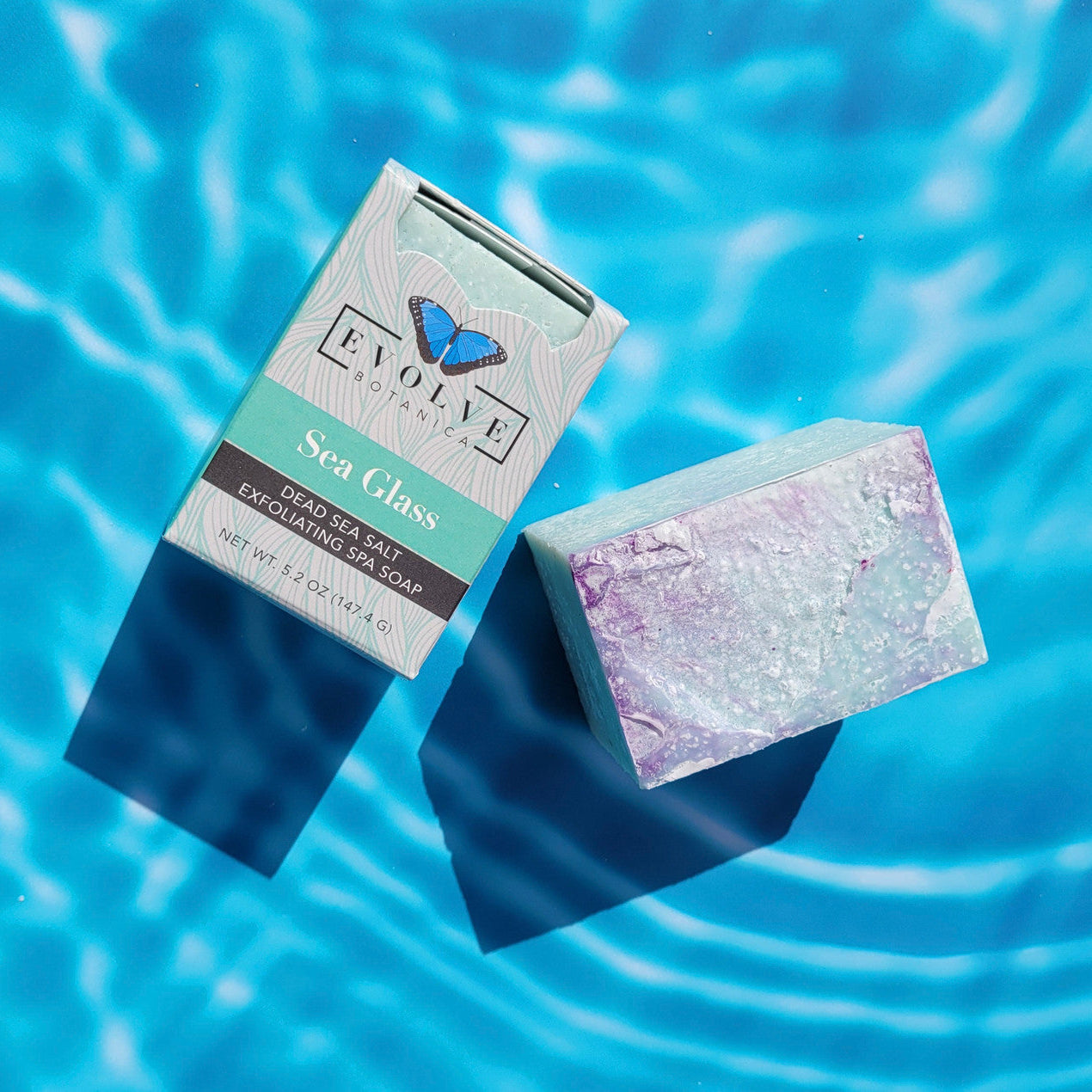 Evolve Botanica Sea Glass Salt Bar specialty soap wrapped in unprinted glassine bag, showcasing a natural, handcrafted appearance.