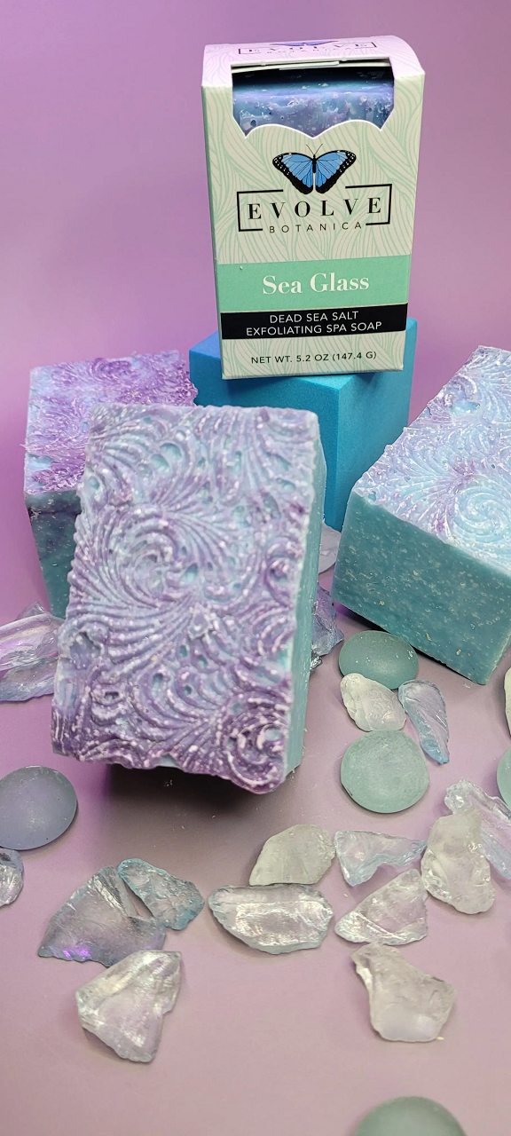 Evolve Botanica Sea Glass Salt Bar specialty soap wrapped in unprinted glassine bag, showing textured sea glass salt surface.
