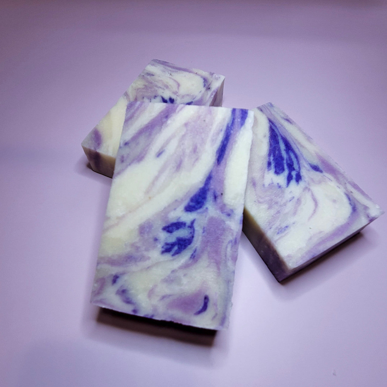 Evolve Botanica Lavender Love goat milk soap wrapped in unprinted glassine bag, highlighting natural lavender scent and handcrafted design.