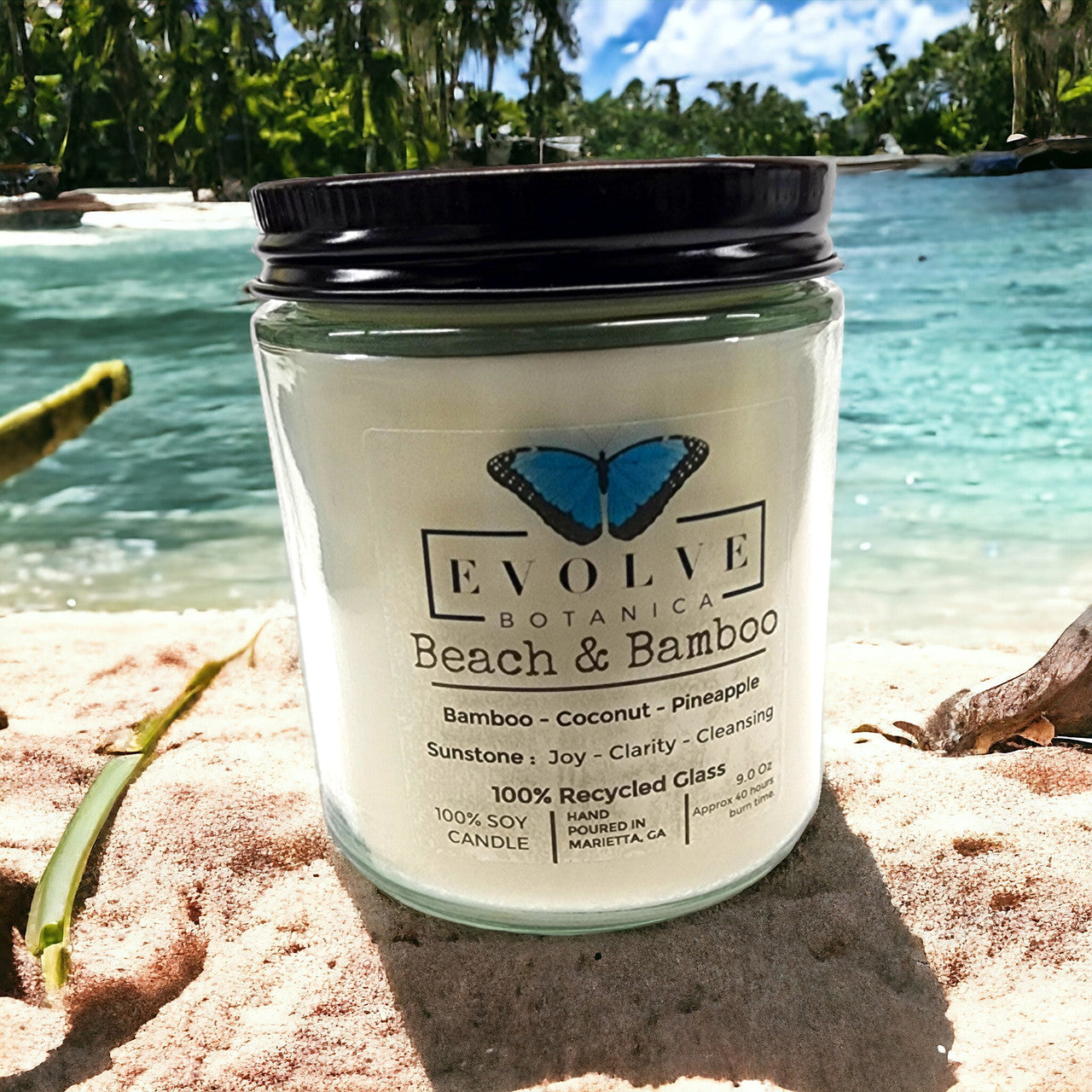 Evolve Botanica 9oz jam jar crystal soy candle with beach and bamboo scent, natural wood wick, and Sunstone accents.