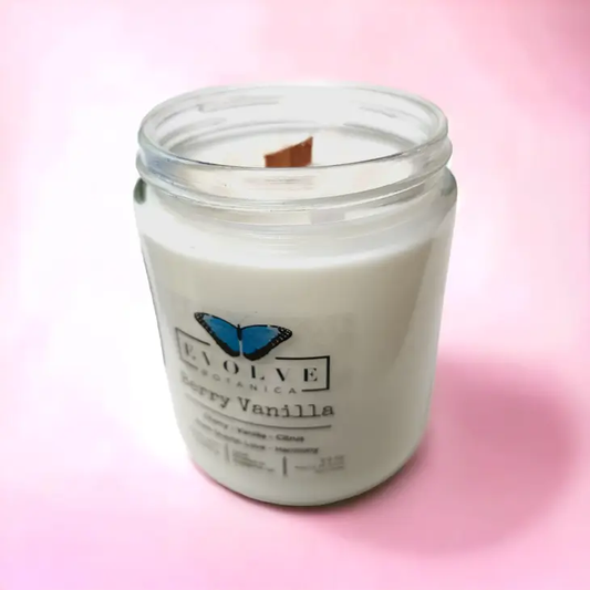 Evolve Botanica Classic 9oz Jam Jar Crystal Soy Candle with Berry Vanilla scent, featuring a rose quartz crystal and natural wood wick.