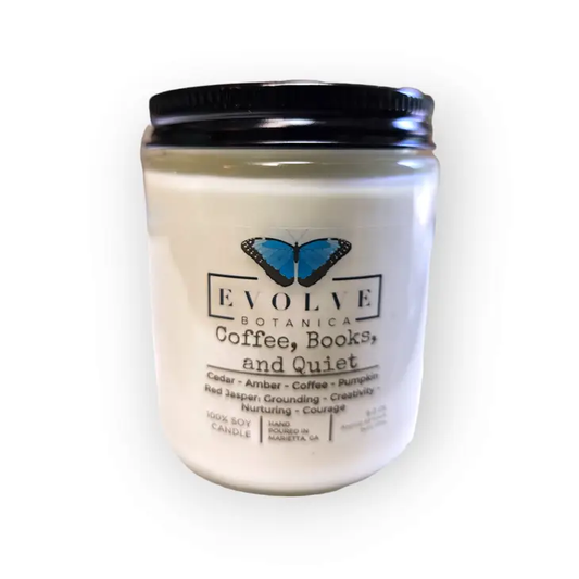 Evolve Botanica 9oz jam jar crystal soy candle with natural wood wick, labeled Coffee, Books, & Quiet, in Jasper style.