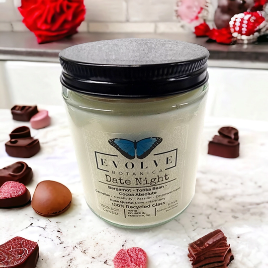 Evolve Botanica Classic 9oz Jam Jar Crystal Soy Candle with rose quartz and carnelian for date night ambiance.
