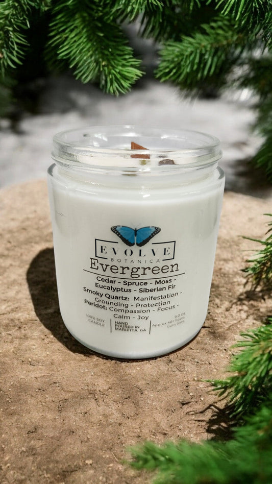 Classic 9oz Jam Jar soy candle by Evolve Botanica with evergreen scent, featuring smoky quartz and peridot crystals.