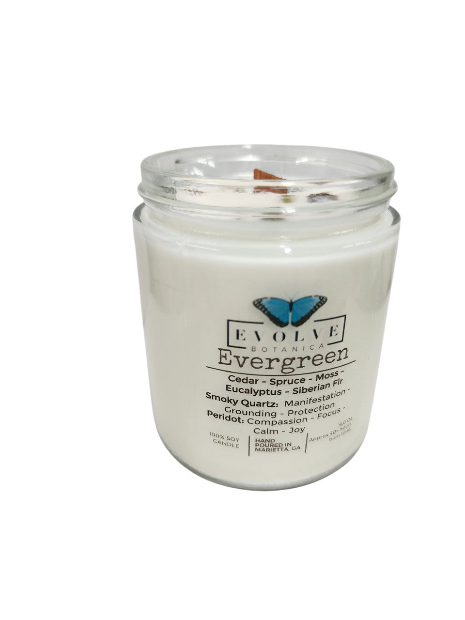 Evolve Botanica Classic 9oz Jam Jar Crystal Soy Candle with evergreen scent, smoky quartz, and peridot accents, natural wood wick.