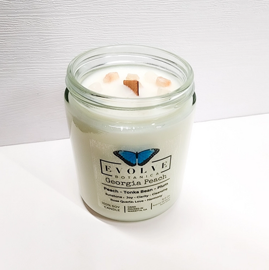 Evolve Botanica Classic 9oz Jam Jar Crystal Soy Candle with Georgia Peach scent, featuring Sunstone and Rose Quartz crystals.
