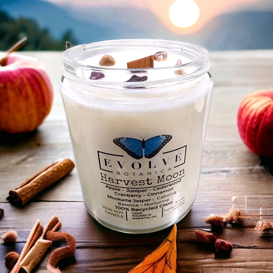 Evolve Botanica Classic 9oz jam jar crystal soy candle with harvest moon scent and Mookite stone, natural wood wick.