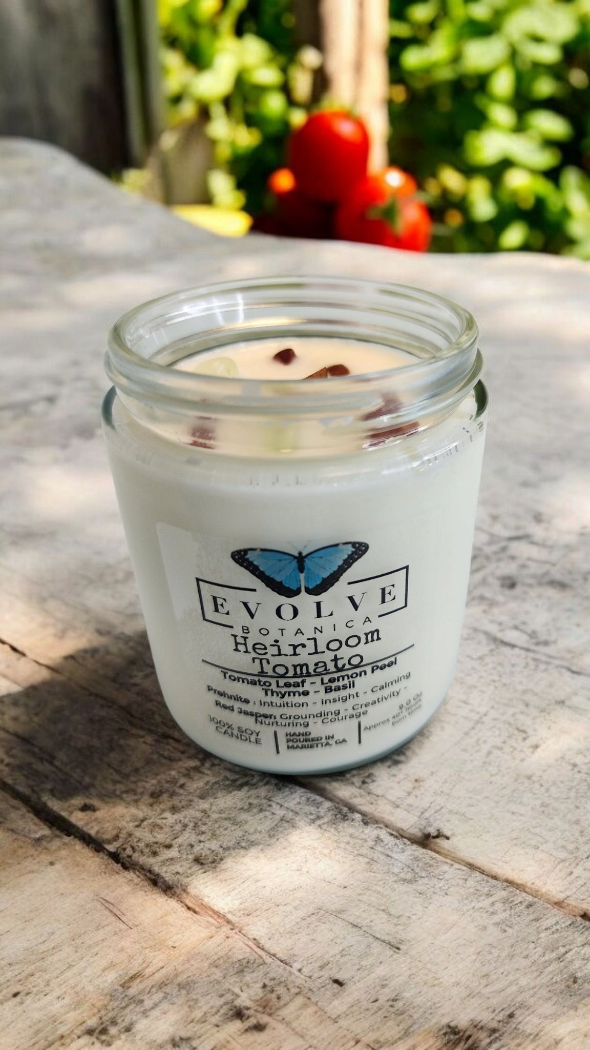 Evolve Botanica 9oz Jam Jar soy candle with heirloom tomato scent, prehnite and red jasper crystals, natural wood wick.