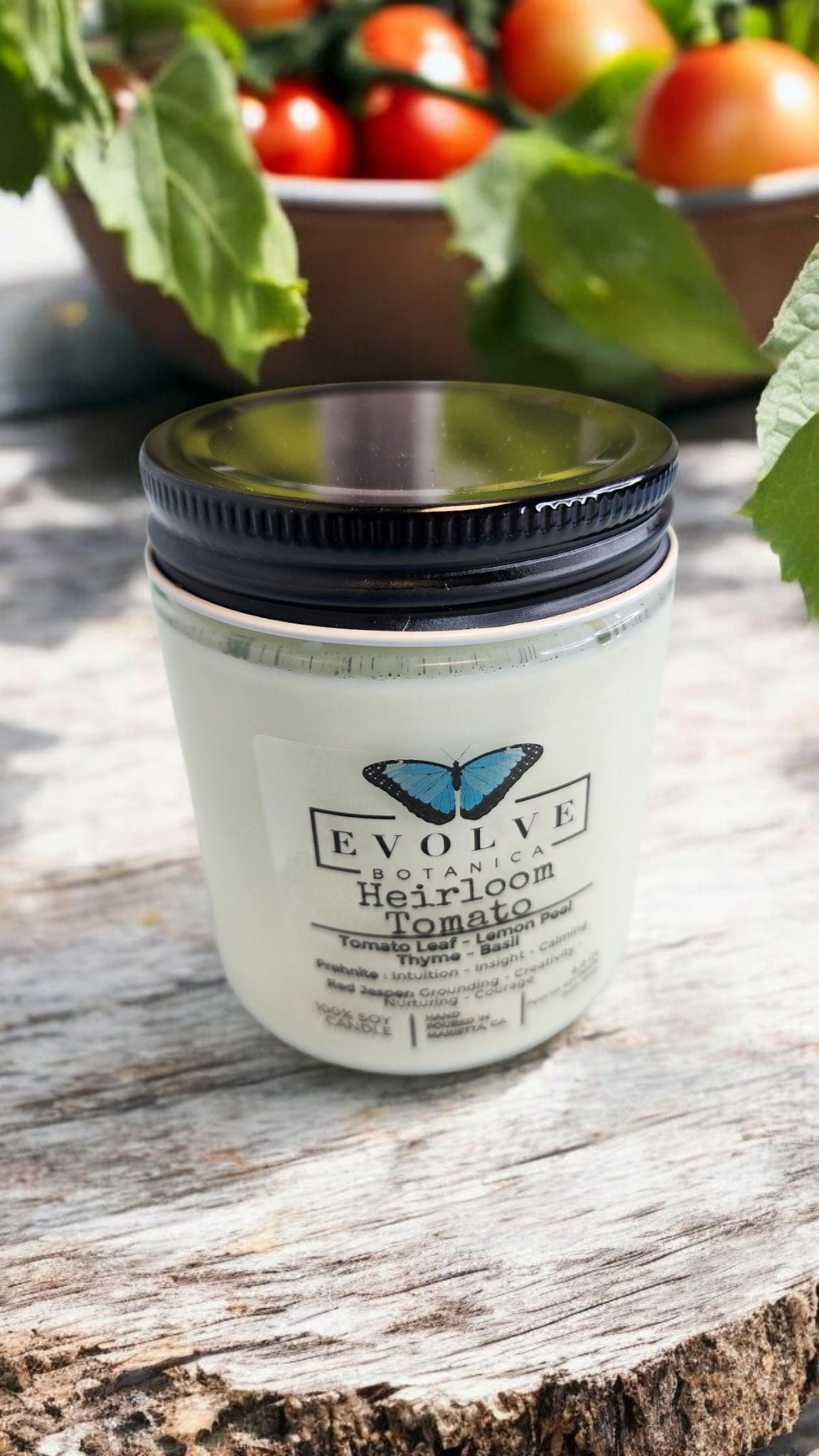 Evolve Botanica 9oz jam jar crystal soy candle with heirloom tomato scent, featuring Prehnite and Red Jasper gemstones, natural wood wick.