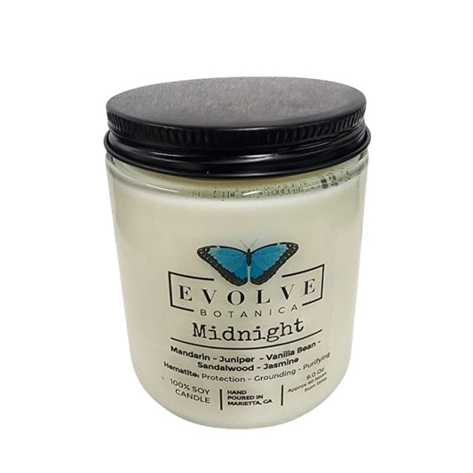Evolve Botanica 9oz jam jar soy candle with natural wood wick, Midnight Super Seven scent, clear glass container.