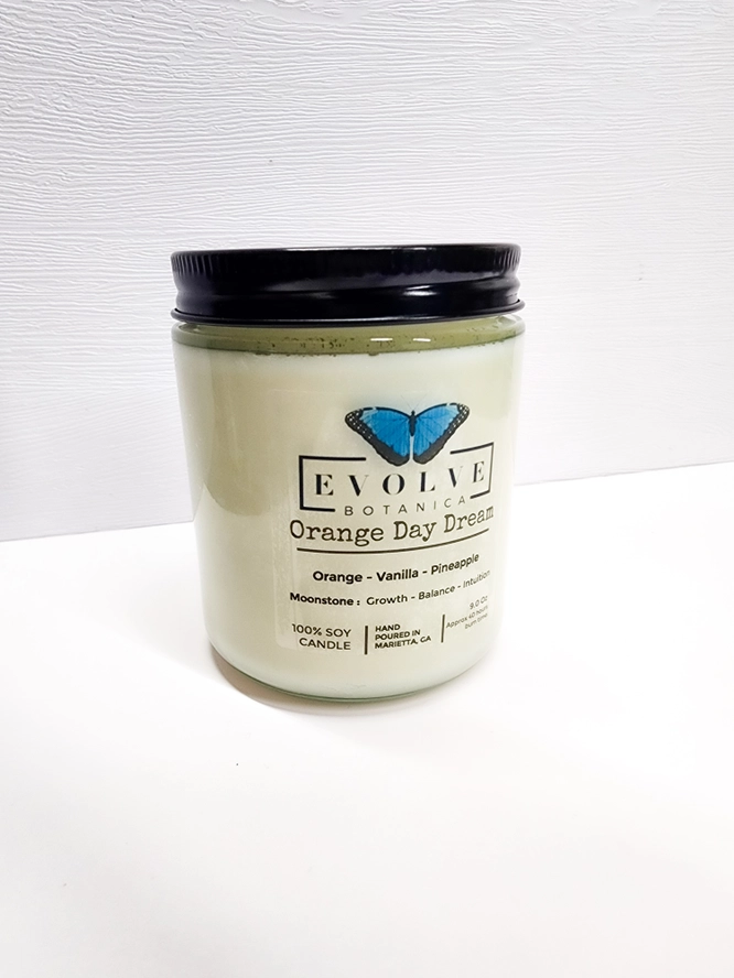 Evolve Botanica Classic 9oz Jam Jar Crystal Soy Candle with orange Day Dream scent and natural wood wick.