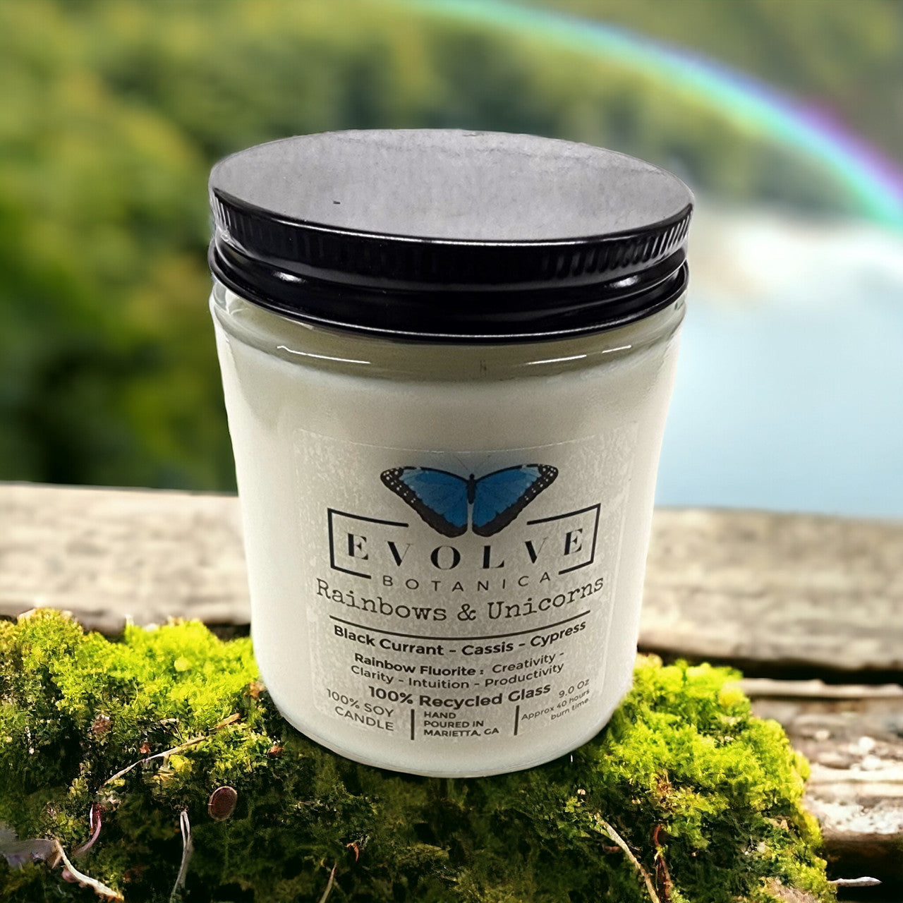 Evolve Botanica 9oz jam jar crystal soy candle with rainbows, unicorns design and fluorite stone, natural wood wick for a cozy ambiance.
