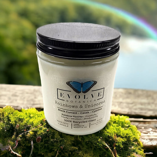 Evolve Botanica 9oz jam jar crystal soy candle with rainbows, unicorns design and fluorite stone, natural wood wick for a cozy ambiance.