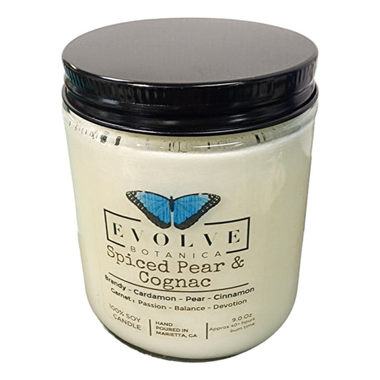 Evolve Botanica Classic 9oz jam jar crystal soy candle with spiced pear and cognac scent, garnet-colored wax and natural wood wick