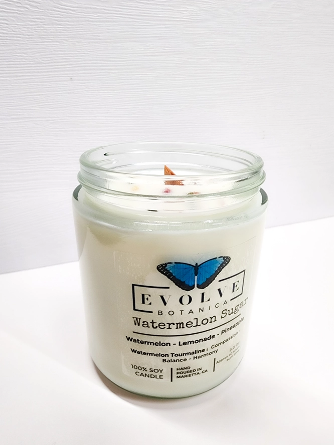 Evolve Botanica 9oz Crystal Soy Candle in jam jar with natural wood wick, Watermelon Sugar scent and Watermelon Tourmaline crystal inside