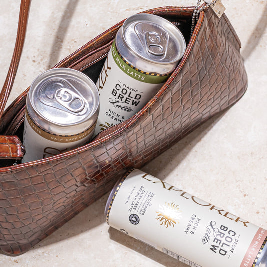 Cold Brew Oat Latte 12-pack by Explorer Cold Brew showing 12 creamy oat milk coffee cans with caffeine options.