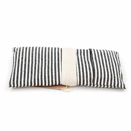 Lavender eye pillow from Our Lavender Co, heating and cooling pad with soft fabric, used for relaxation and eye comfort.