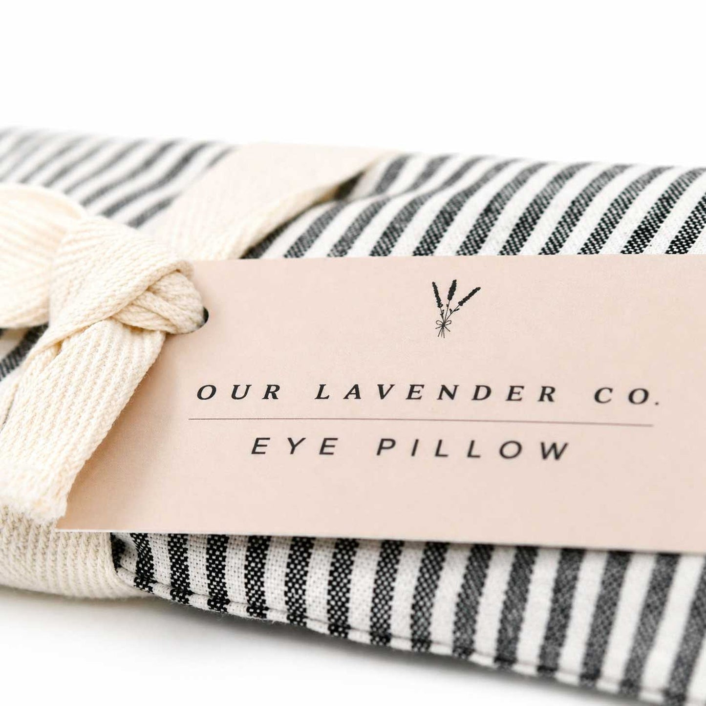 Lavender eye pillow from Our Lavender Co, heated or cooled, with soft fabric cover, used for relaxation and eye comfort.