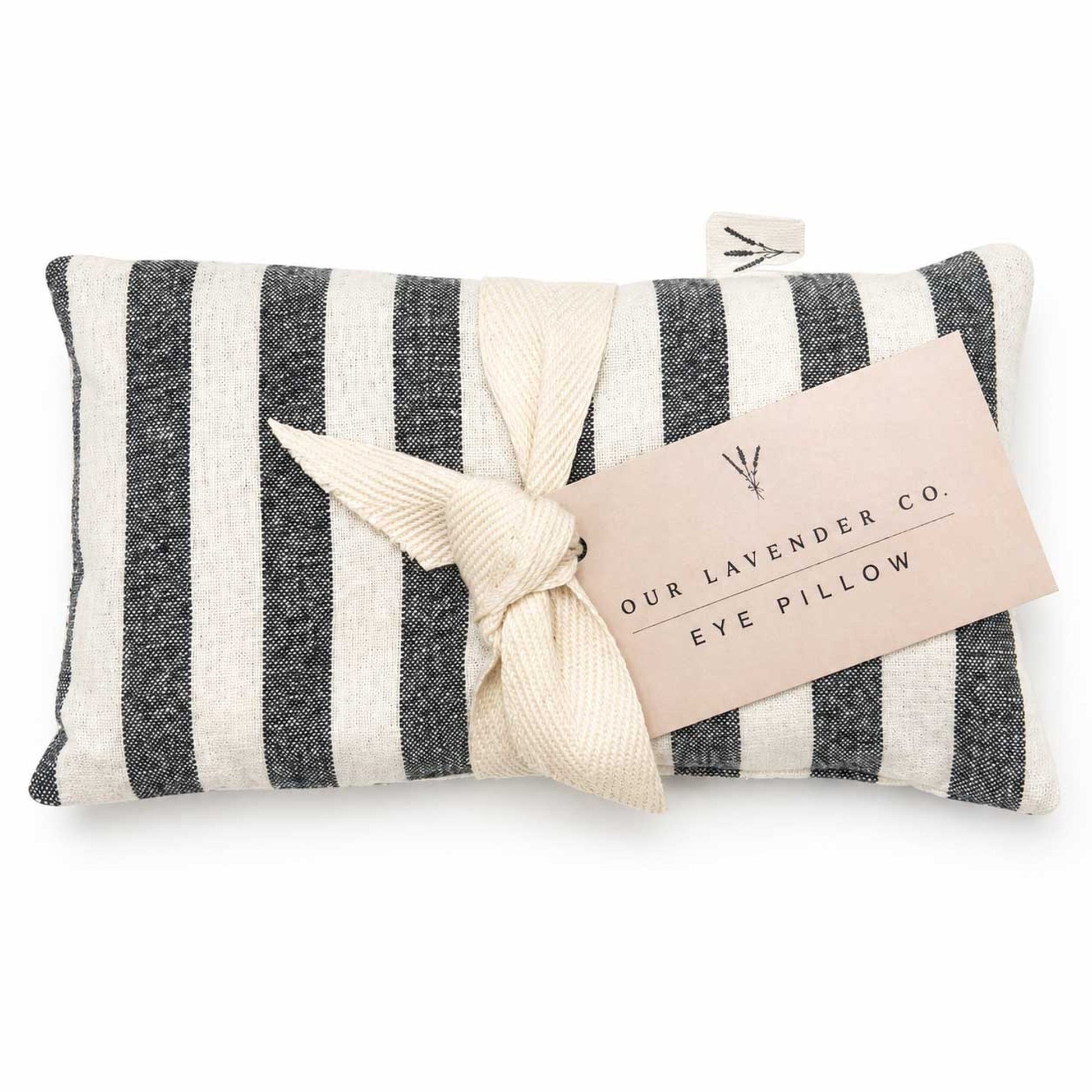Lavender eye pillow from Our Lavender Co with soft fabric cover, used for relaxing heat or cooling therapy in bath and body routines.