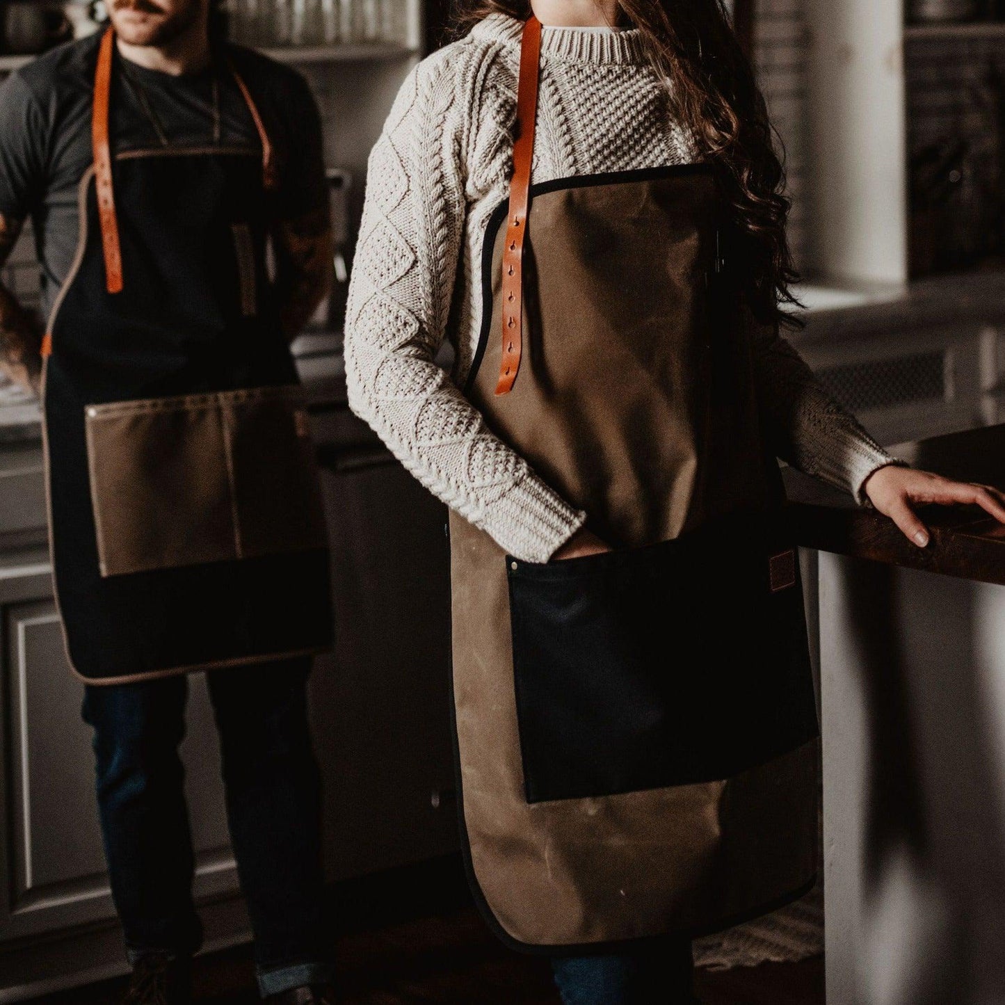 Waxed canvas apron by The Local Branch, USA made, featuring durable, weather-resistant material and adjustable straps.