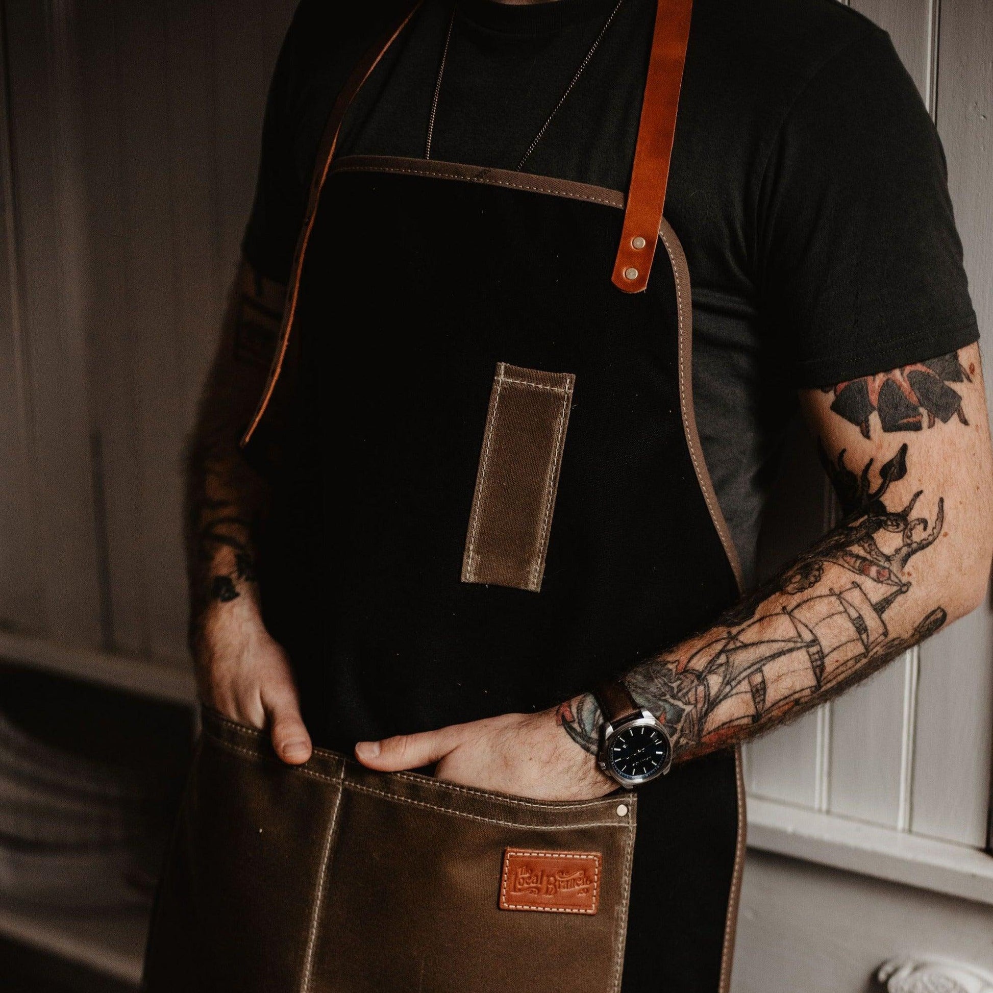Waxed canvas apron by The Local Branch, USA made, with durable straps and a rugged, stylish design for work or gardening.