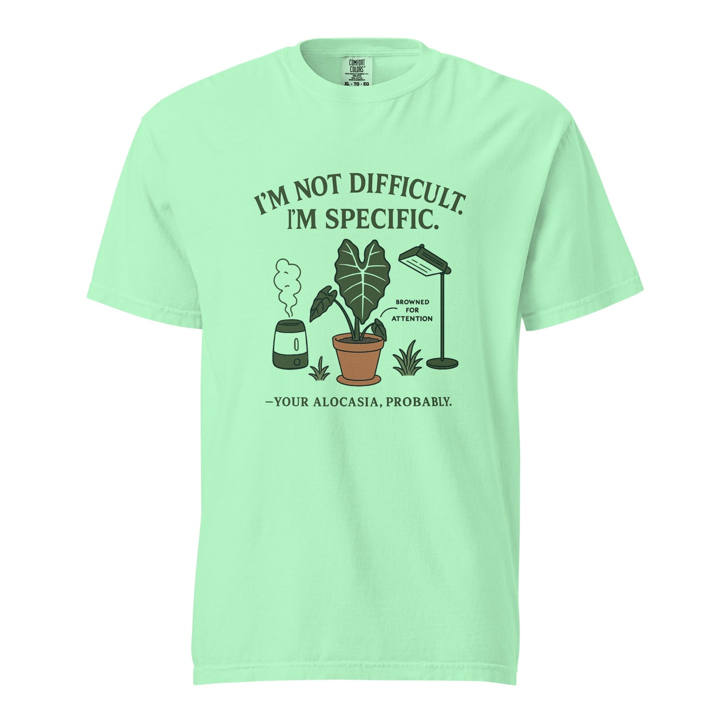 FGMN Originals heavyweight T-shirt featuring the text "I'm Not Dramatic. I'm Specific." in a granite color.