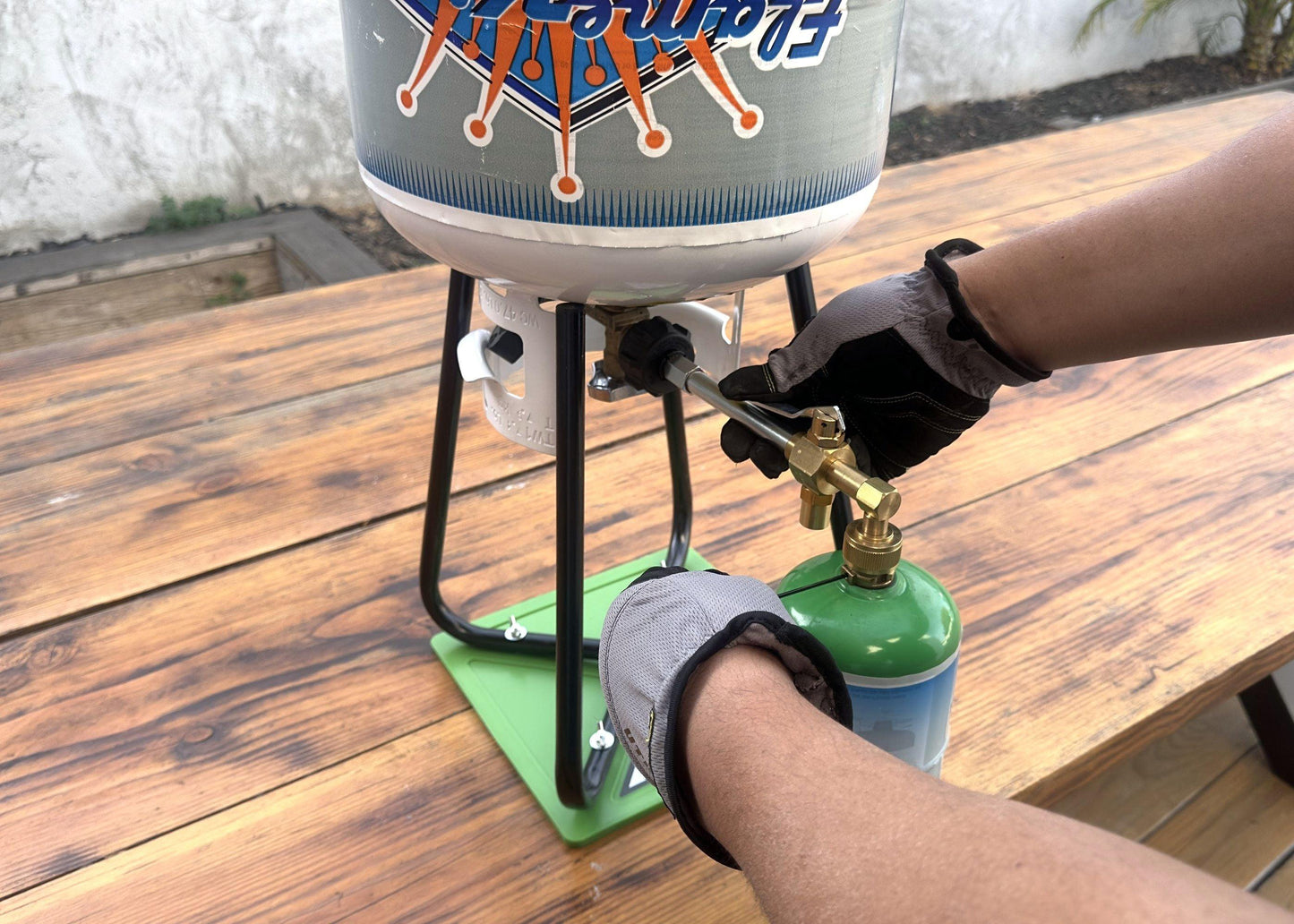 Flame King Eco-Friendly 1lb Refillable Propane Cylinder with Refill Kit, reusable and portable for outdoor cooking and camping.