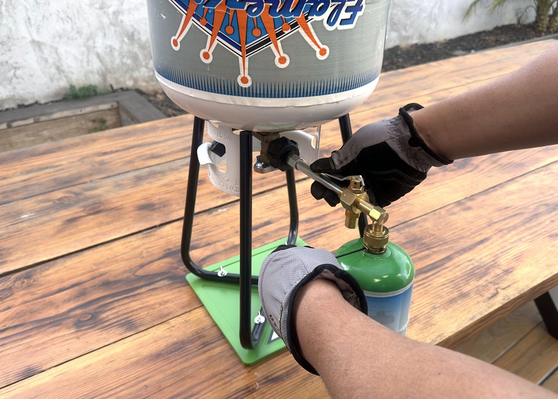 Flame King Eco-Friendly 1lb Refillable Propane Cylinder with Refill Kit, reusable and portable for outdoor cooking and camping.