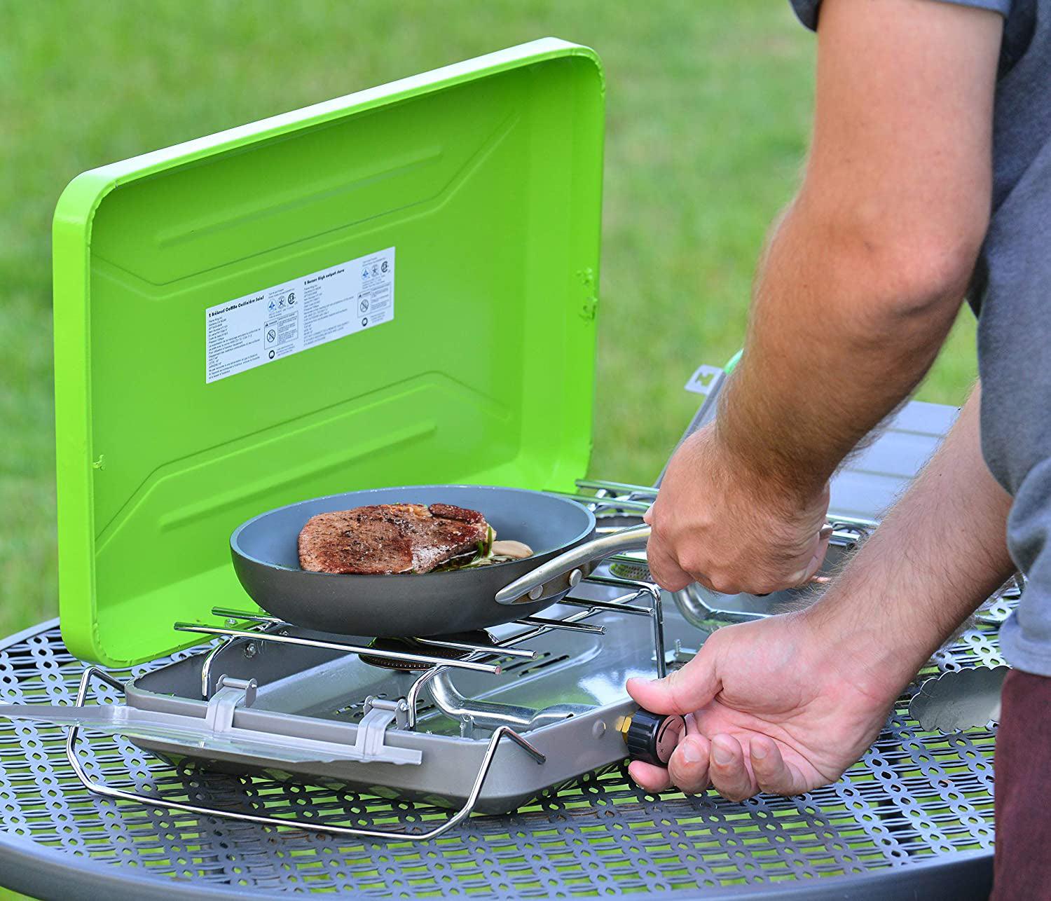 Flame King 2 burner portable propane camping stove with black control knobs and sturdy metal construction for outdoor cooking.